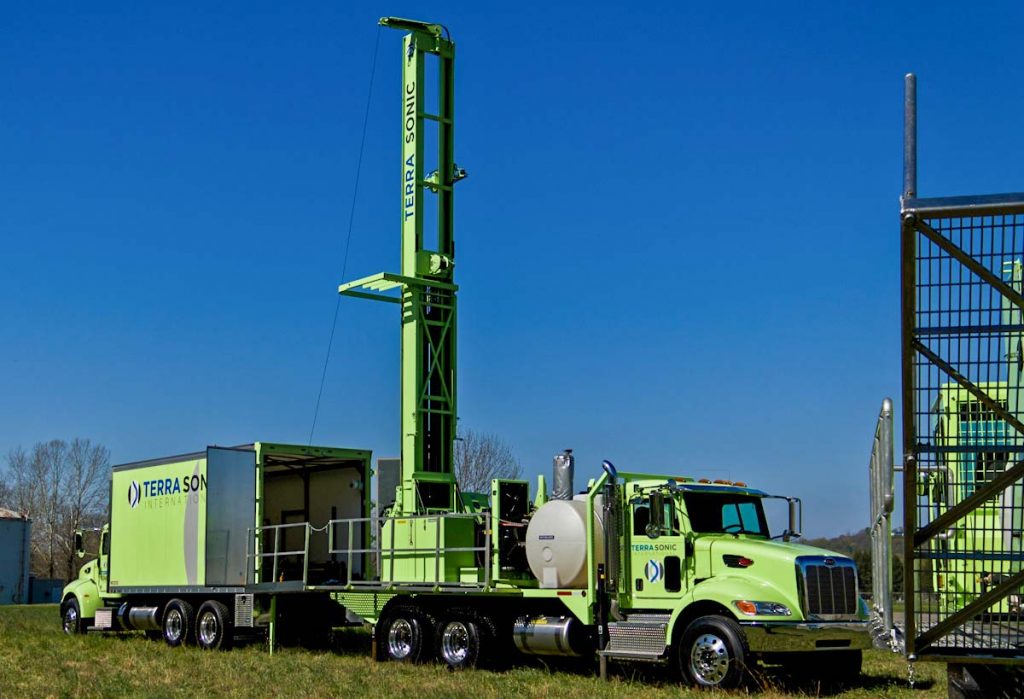 TSi Support Truck for sonic drill rig in use with sonic drill rig