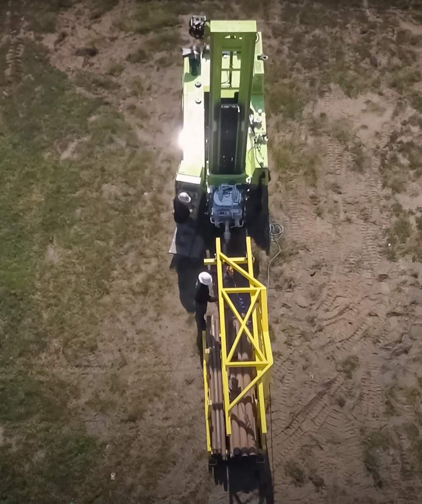 arial view of TUG pipe handling for sonic drill rig in action