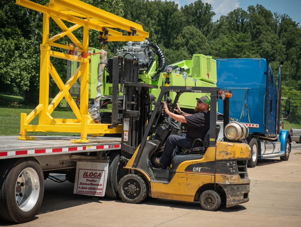 loading TUG pipe handling for sonic drill rig